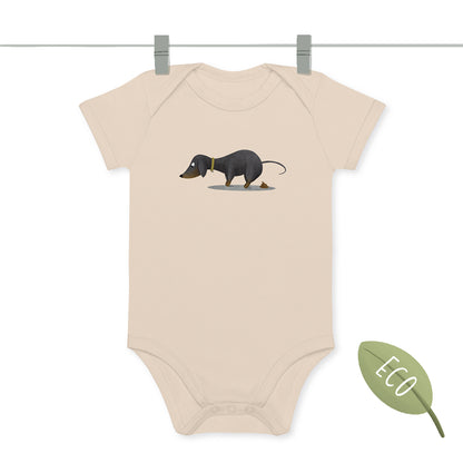Baby Bodysuit beige color with a print of a black & tan Dachshund pooping